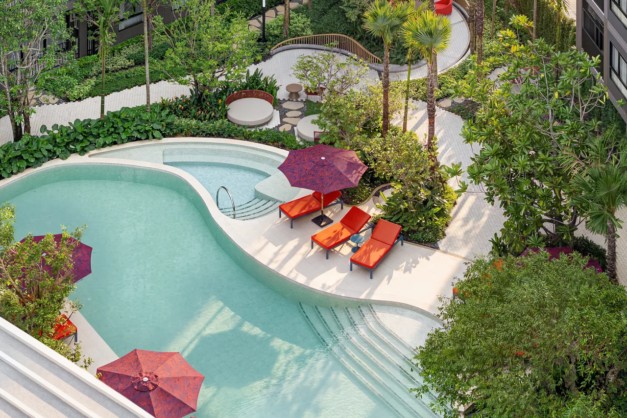 The Base Cherngtalay, Phuket: pool terrace with loungers and garden