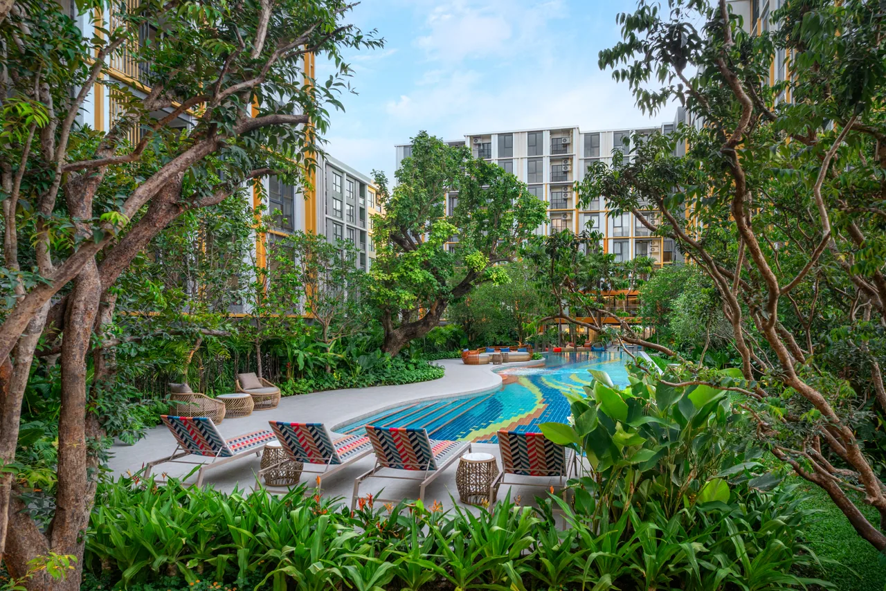 The Base Rise, Phuket: completed pool courtyard with sun loungers