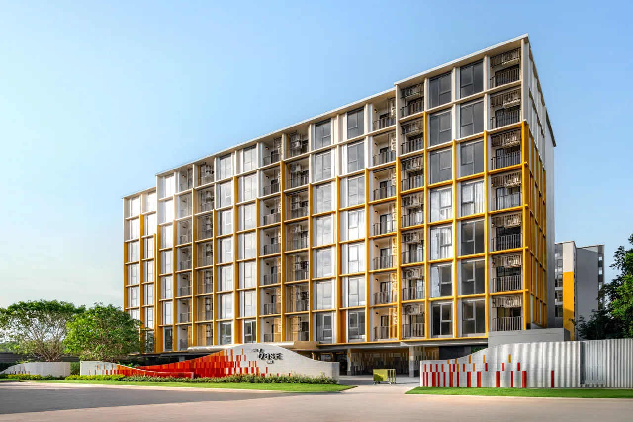 The Base Rise, Phuket: completed residential facade with yellow accents